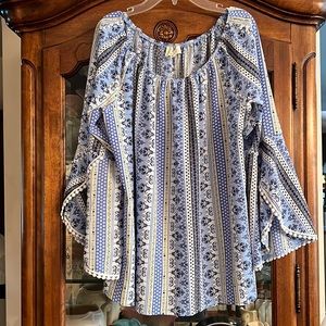 Ember Boho top with unique trim and bell sleeves.